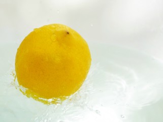 Polonne / Ukraine - 03 August 2018: the lemon falls into the water