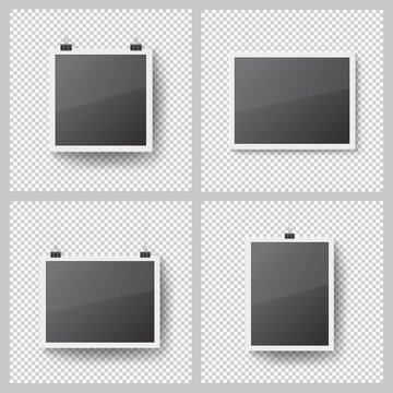 Realistic blank photo frames set on transparent background. Template picture frame hanging on binder clips. Isolated vector framework with shadow on the wall. Black empty place for presentation
