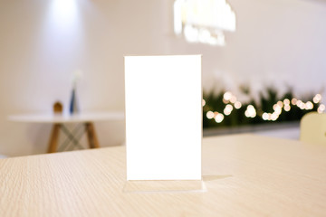 Menu frame standing on wood table in Bar restaurant cafe. space for text marketing promotion.