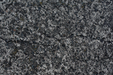 Top view of textured background wallpaper of grain grey asphalt