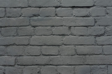 Exterior brick wall painted in grey color