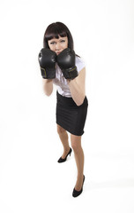 Business woman in boxing gloves