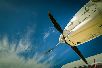Fototapeta na wymiar view of aircraft propeller blade and turboprop engines with blue sky background