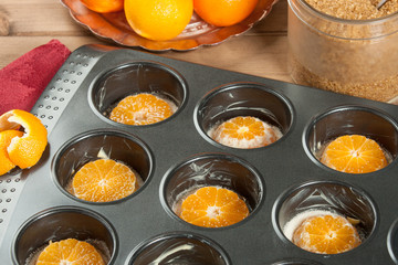 Cooking Process Of Homebaked Upside Down Clementine Muffins. Baking Tray.