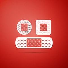 Set Bandage plaster icon isolated on red background. Medical plaster, adhesive bandage, flexible fabric bandage. Flat design. Vector Illustration