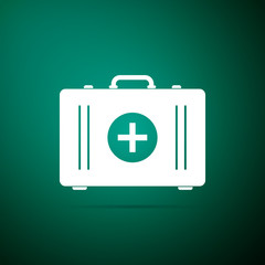 First aid kit icon isolated on green background. Medical box with cross. Medical equipment for emergency. Healthcare concept. Flat design. Vector Illustration