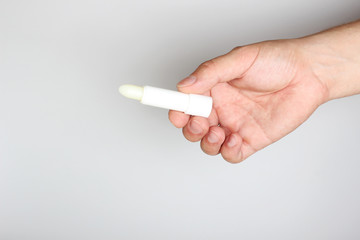 hygienic lipstick in hand