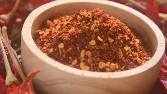 Chili powder in wood bowl rotation
