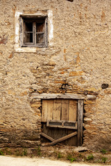 Village house with old wooden door