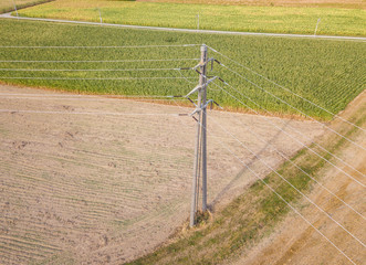 Aerial view of power pylon on farmland in Switzerland, Europe