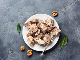 Oriental sweet dessert. Eastern halva on a white plate. Top view.