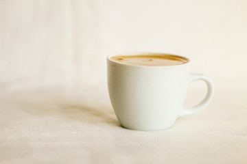 White coffee cup, white background, selective focus