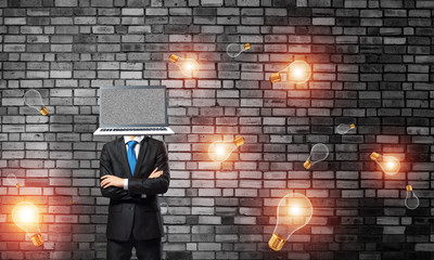 Businessman with laptop instead of head.