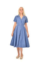 full length portrait of blonde girl wearing blue dress. standing pose. isolated on white  studio background.