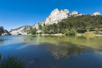 Fototapeta na wymiar Little lake in the Alpilles close to St. Remy de Provence, Barrage de Peiroou. Buches du Rhone, Provence, France.