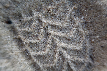 Footprint of shoes on sand, macro background