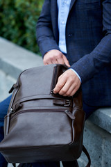 Businessman style. Men style. Young businessman with backpack