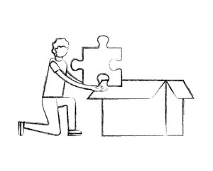 man with puzzle piece in cardboard box