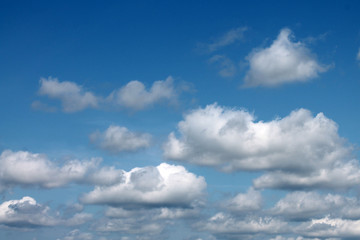 Naklejka na ściany i meble white clouds against blue sky for background closeup