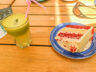 Green smoothie with pie on a table