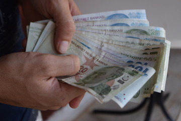 Turkish Lira in man hands