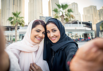 Two arabian girlfriends bonding and having fun