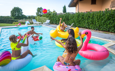 Friends having fun in a swimming pool