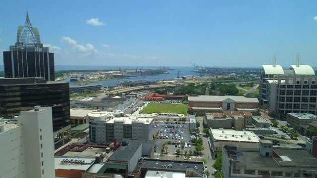 Aerial reveal Port Mobile Alabama behind Downtown cityscape