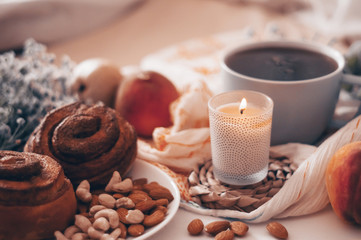 Breakfast in bed, a tray of tea, croissants, fruit, flowers. Morning. Cozy Apartment. Romance. bright Background layout. a day off