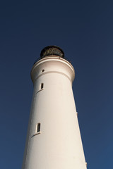 White Lighthouse with sun reflection and lens flare, Hirtshals Fyr in Hirtshals, North Jutland in Denmark, Europe