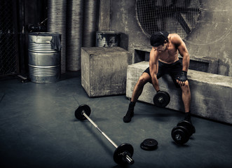 Fototapeta na wymiar Man training in a gym
