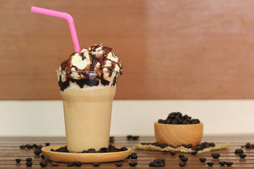ice coffee and caramel smoothie on table in coffee shop.