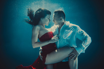 Couple swimming underwater