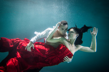 Couple swimming underwater