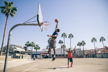 Friends playing basketball