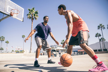 Friends playing basketball