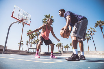 Friends playing basketball