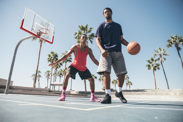 Fototapeta premium Friends playing basketball