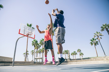 Friends playing basketball