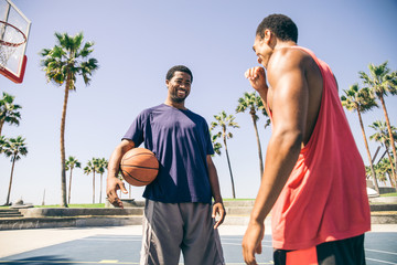 Fototapeta premium Baketball player making a dunk