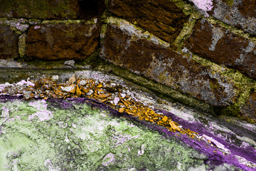 Dirty brick wall with fragments