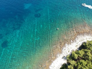 people on the water near labadusa beach okrug gornji