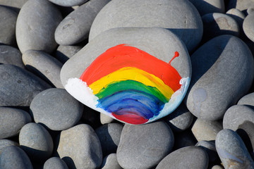 Obraz premium painted stones. A rainbow of flowers in paint on stones.
