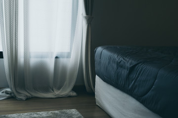 close up soft bed blanket and fur carpet rug near window bedroom