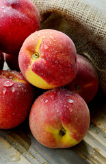 Many Fresh Peach with water drops and shadow on wooden background (German name is Pfirsich)
The amount of sugar in peaches is a lot natural and does not negatively affect health.