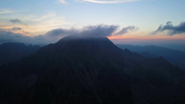 Time lapse aerial view of sunset over Gerlachov Peak (Gerlachovsky stit) in High Tatras mountains, Slovakia