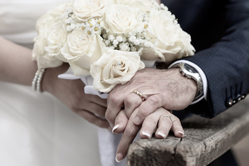 hands of newlyweds on their wedding day