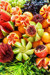 Bright juicy fruits in the assortment on the counter of the fruit market.
