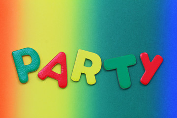 Word party written with colorful letters on vivid background
