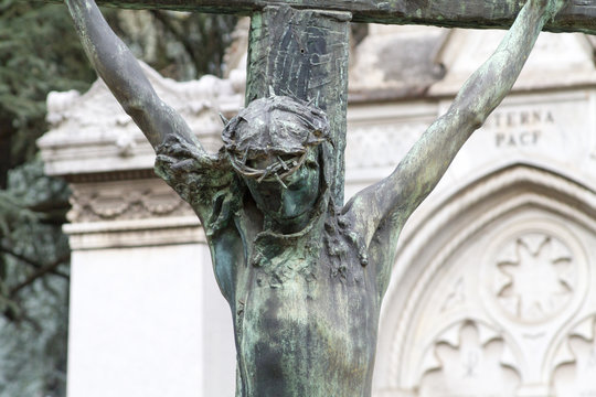 Milano, Italy. 2018/2/8. A statue of Jesus Christ on the cross at the Cimitero Monumentale ("Monumental Cemetery") in Milan, Italy.